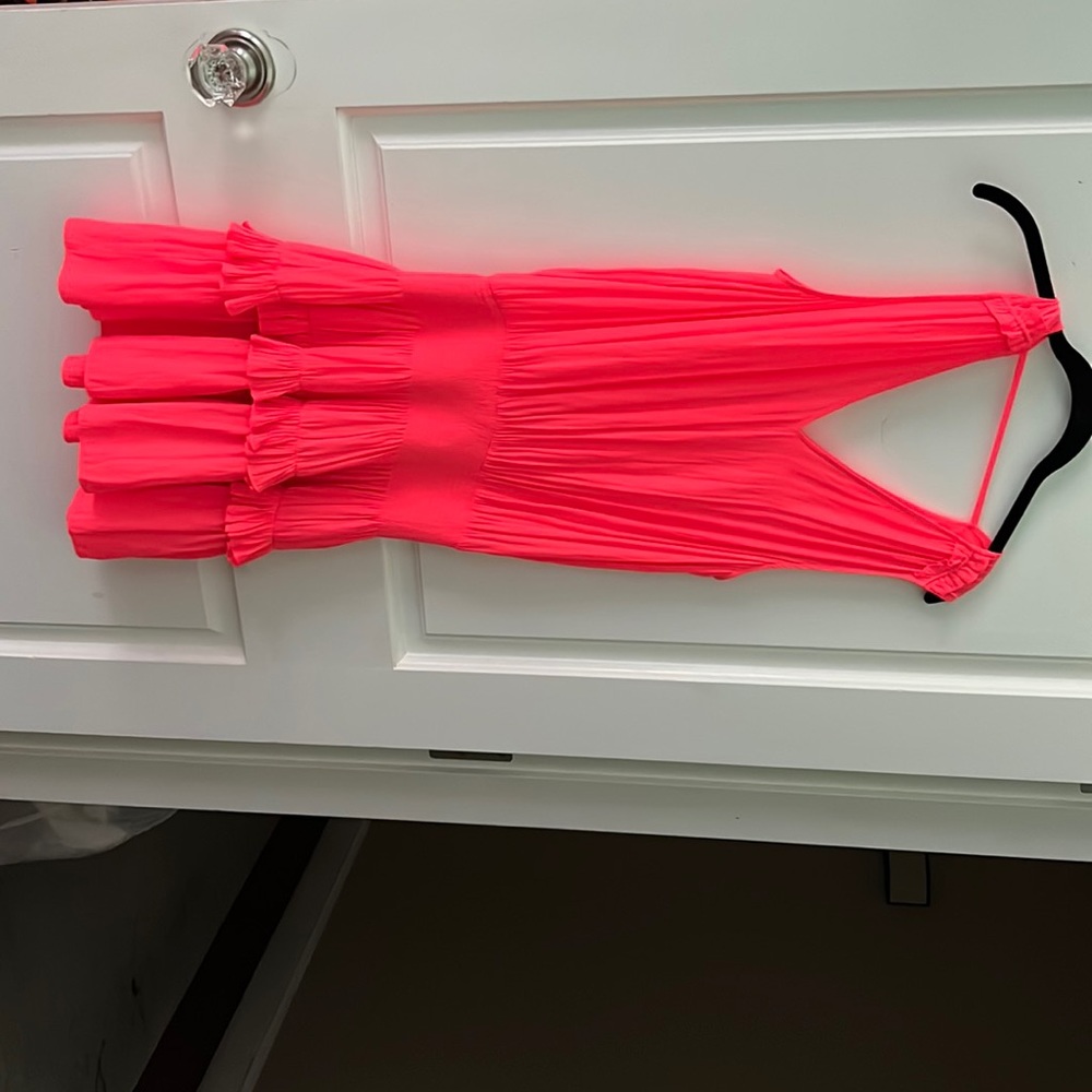 orange mini dress with shoulder detail and ruffle bottom